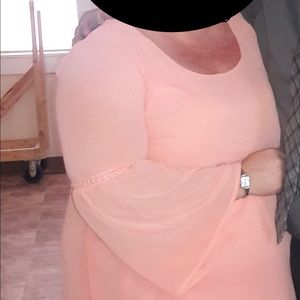 Coral pink dress.  Worn once.  Has been hanging in The closet since.